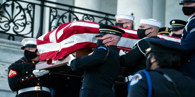 The casket of slain U.S. Capitol Police officer William "Billy" Evans is carried from the Capitol by a joint services honor guard Washington on Tuesday. (AP/The Washington Post)