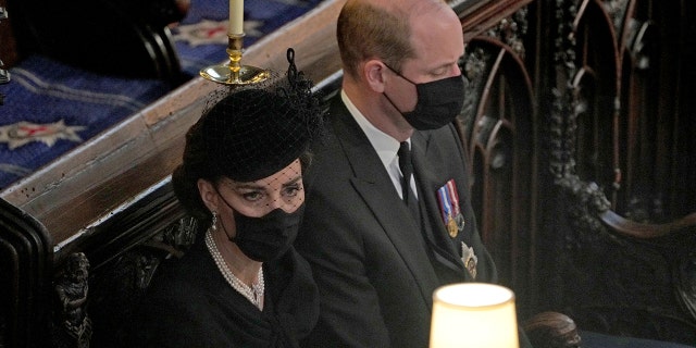 Britain's Prince William and Kate Duchess of Cambridge sit together at St. George’s Chapel during the funeral for Prince Philip, at Windsor Castle, Windsor, England. Prince Philip died April 9 at the age of 99 after 73 years of marriage to Britain's Queen Elizabeth II. 