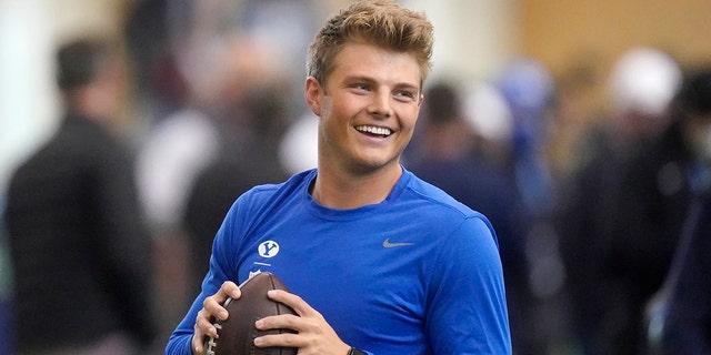 FILE - BYU quarterback Zach Wilson warms up before participating in the school's pro day football workout for NFL scouts in Provo, Utah, in this Friday, March 26, 2021, file photo. Wilson is expected to be a first-round pick in the NFL Draft, April 29-May 1, 2021, in Cleveland. (AP Photo/Rick Bowmer, File)