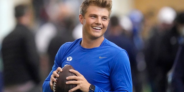FILE - BYU quarterback Zach Wilson warms up before participating in the school's pro day football workout for NFL scouts in Provo, Utah, in this Friday, March 26, 2021, file photo. Wilson is expected to be a first-round pick in the NFL Draft, April 29-May 1, 2021, in Cleveland. (AP Photo/Rick Bowmer, File)