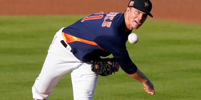Houston Astros starting pitcher Zack Greinke throws during the first inning of the team's spring training baseball game against the Miami Marlins, Friday, March 26, 2021, in West Palm Beach, Fla. (AP Photo/Lynne Sladky)