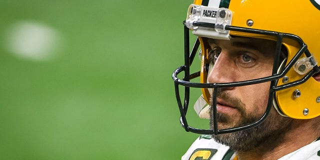 Aaron Rodgers #12 of the Green Bay Packers looks on before the first half against the Detroit Lions at Ford Field in Detroit, Dec. 13, 2020.