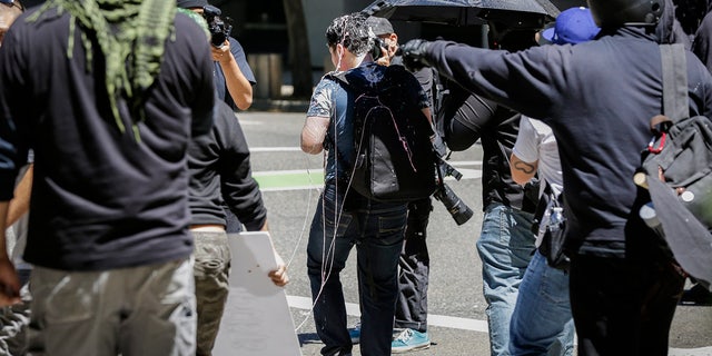 PORTLAND, OR - JUNE 29: Andy Ngo, a Portland-based journalist, is seen covered in an unknown substance after unidentified Rose City Antifa members attacked him on June 29, 2019 in Portland, Oregon. Several groups from the left and right clashed after competing demonstrations at Pioneer Square, Chapman Square, and Waterfront Park spilled into the streets. According to police, medics treated eight people and three people were arrested during the demonstrations. (Photo by Moriah Ratner/Getty Images)