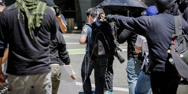 Andy Ngo covered in an unknown substance after unidentified Rose City Antifa members attacked him in 2019 in Portland, Ore.