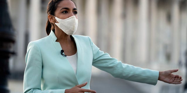 Rep. Alexandria Ocasio-Cortez D-NY, speaks during a TV interview on Capitol Hill in Washington, Tuesday, April 20, 2021, after the jury returned guilty verdicts on all three charges in the murder trial of former Minneapolis police Officer Derek Chauvin in the death of George Floyd. (AP Photo/Jose Luis Magana)