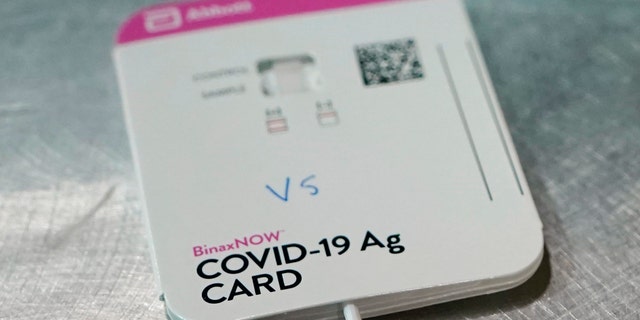 A BinaxNOW rapid COVID-19 test made by Abbott Laboratories, in Tacoma, Wash. On Wednesday, March 31, 2021, the FDA said Abbott’s BinaxNow and Quidel’s QuickVue tests can now be sold without a prescription for consumers to test themselves repeatedly at home.