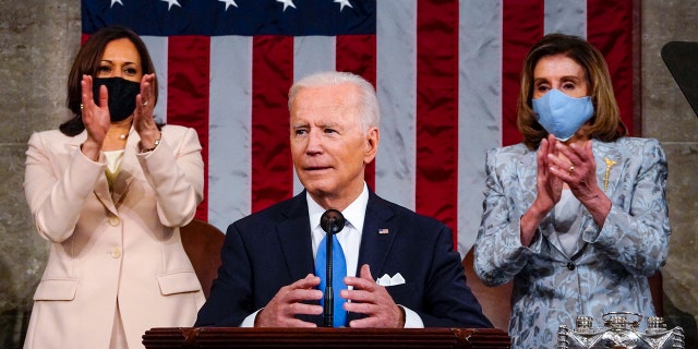 Vice President Kamala Harris and House Speaker Nancy Pelosi of Calif., stand and applaud as President Joe Biden addresses a joint session of Congress, Wednesday, April 28, 2021. (Melina Mara/The Washington Post via AP, Pool)