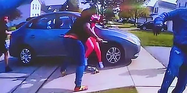 Bodycam video shows Reardon arriving at the scene and encountering Bryant swinging a knife and bowling over one woman, identified later as Shai-Onta Lana Craig-Watkins, 20, before lunging with the weapon toward Tionna Bonner, 22, pinning her against a car.