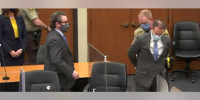 Former Minneapolis police officer Derek Chauvin is handcuffed to be led away after a jury found him guilty of all charges in his trial for second-degree murder, third-degree murder and second-degree manslaughter in the death of George Floyd in Minneapolis, Minnesota, U.S. April 20, 2021 in a still image from video. Pool via REUTERS