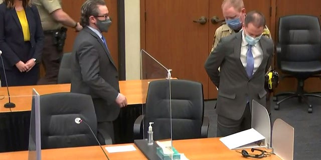 Former Minneapolis police officer Derek Chauvin is handcuffed to be led away after a jury found him guilty of all charges in his trial for second-degree murder, third-degree murder and second-degree manslaughter in the death of George Floyd in Minneapolis, Minnesota, U.S. April 20, 2021 in a still image from video. Pool via REUTERS