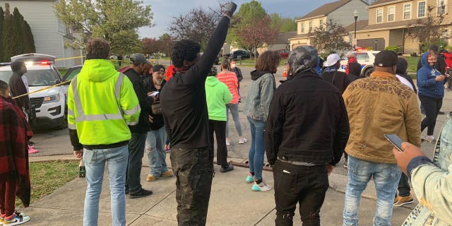 A crowd gathers at the scene of a fatal officer-involved shooting in Columbus, Ohio.