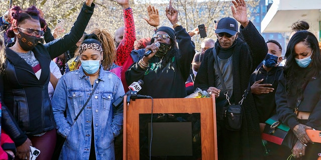 DMX's ex-wife, Tashera Simmons, left, and his fiancée Desiree Lindstrom, second from left, are accompanied by family and friends as they pray during a vigil outside White Plains Hospital, Monday, April 5th.