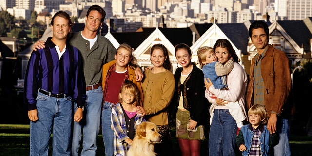 On location in San Francisco – pictured, from left: Dave Coulier (Joey), Bob Saget (Danny), Jodie Sweetin (Stephanie), Mary Kate Olsen (Michelle), Candace Cameron (D.J.), Andrea Barber (Kimmy), Blake Tuomy-Wilhoit (Nicky), Lori Loughlin (Rebecca), Dylan Tuomy-Wilhoit (Alex), John Stamos (Jesse).