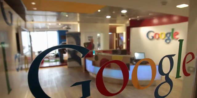 Google logo on the glass door of the office.
