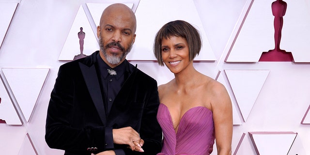 (L-R) Van Hunt and Halle Berry attend the 93rd Annual Academy Awards at Union Station on April 25, 2021 in Los Angeles, California.