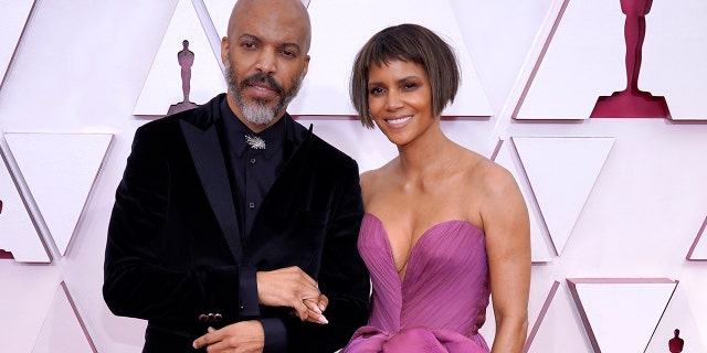 (L-R) Van Hunt and Halle Berry attend the 93rd Annual Academy Awards at Union Station on April 25, 2021 in Los Angeles, California.