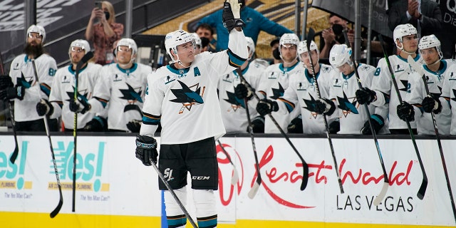 San Jose Sharks center Patrick Marleau (12) waves to the crowd during a small ceremony to mark his passing Gordie Howe for most NHL games played in the first period of an NHL hockey game Monday, April 19, 2021, in Las Vegas. (AP Photo/John Locher)