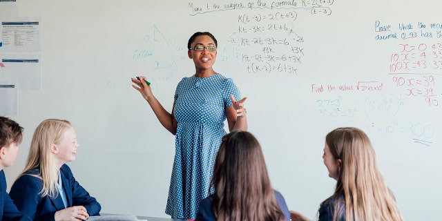 Teacher discussing STEM: Mathematics during class.
