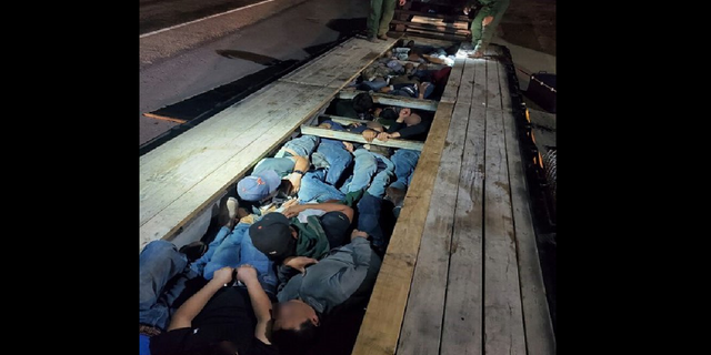 The Border Patrol says its Del Rio, Texas, sector discovered 20 people stuffed underneath the boards of a truck's trailer. (Border Patrol/Chief Patrol Agent Austin Skero)