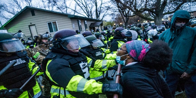 Protesters confront police over the shooting death of Daunte Wright at a rally at the Brooklyn Center Police Department on Monday. (AP/Star Tribune)