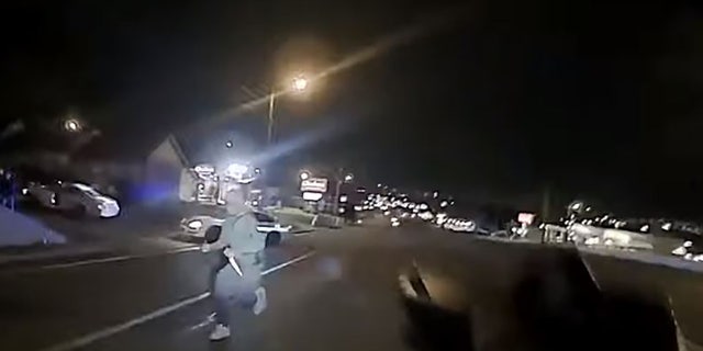 This screengrab taken from police body camera footage shows an unidentified man armed with at least one butcher knife running toward Officer Christopher Royer. (Metro Nashville Police Department)