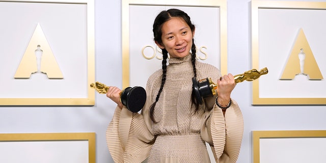 Chloe Zhao, winner of the awards for best picture and director for "Nomadland," poses in the press room at the Oscars on Sunday, April 25, 2021, at Union Station in Los Angeles.