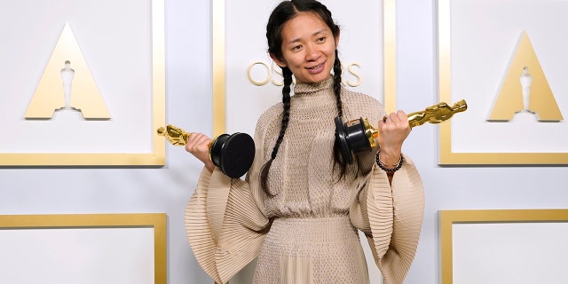 Chloe Zhao, winner of the awards for best picture and director for "Nomadland," poses in the press room at the Oscars on Sunday, April 25, 2021, at Union Station in Los Angeles.