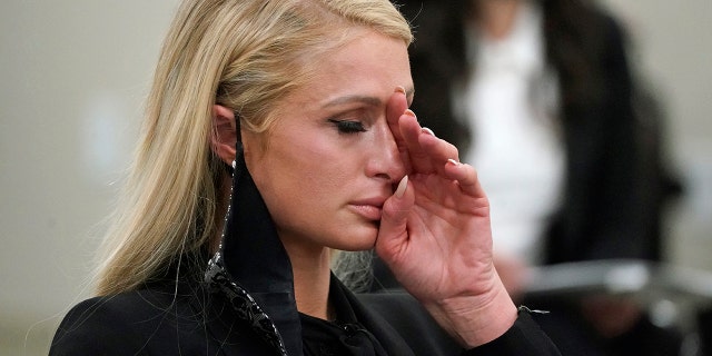 Paris Hilton wipes her eyes after speaking at a committee hearing at the Utah State Capitol on Feb. 8, 2021, in Salt Lake City.