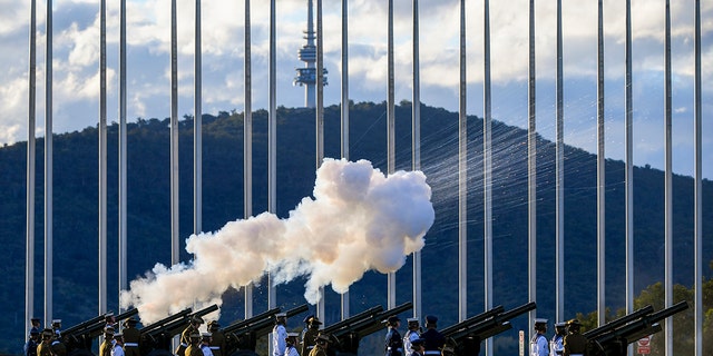 The Australian Federation Guard fire a 41 gun salute to mark the passing of Prince Philip on the forecourt of Parliament House, in Canberra, Australia, Saturday, April 10, 2021. Prince Philip, the husband of Queen Elizabeth II who spent more than seven decades supporting his wife in a role that mostly defined his life, died, Buckingham Palace said Friday. He was 99.