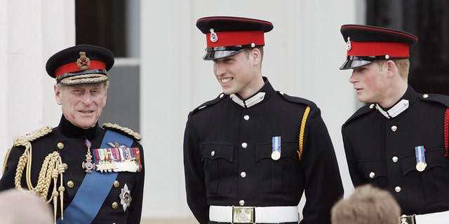 Prince William (C) and Prince Harry (R) chat to their grandfather, Prince Philip, Duke of Edinburgh (L) in 2006. 