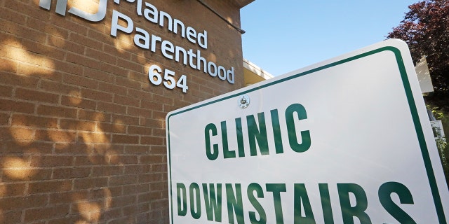 FILE - In this Aug. 21, 2019 photo, a sign is displayed at Planned Parenthood of Utah in Salt Lake City. 