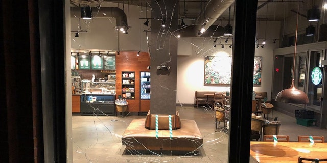 Rioters smashed the window of a Starbucks in Portland Friday night. 