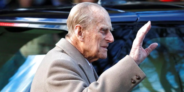 Britain's Prince Philip waves to the public as he leaves after attending a Christmas day church service in Sandringham, England, Dec. 25, 2016. The prince died April 9, 2021, at age 99.