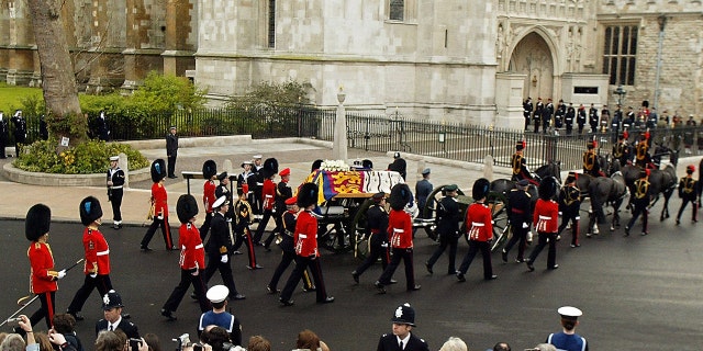 Queen Elizabeth The Queen Mother's coffin was carried to Westminster Abbey for her funeral ceremony in 2002 on the back of a horse-drawn gun carriage 