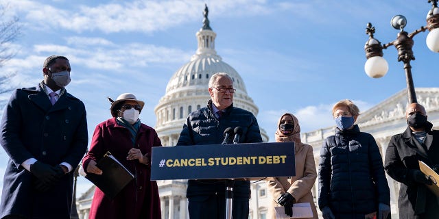 Student loan debt forgiveness added approximately $400 billion to the national debt. FILE:  Senate Majority Leader Chuck Schumer (D-NY) speaks during a press conference about student debt outside the U.S. Capitol on February 4, 2021, in Washington, DC. 