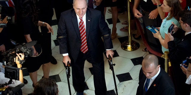House Republican Whip Steve Scalise leaves the House chamber in the Capitol in Washington, Thursday, Sept. 28, 2017. To hugs and a roaring bipartisan standing ovation, Scalise returned to the House, more than three months after a baseball practice shooting left him fighting for his life.( AP Photo/Jose Luis Magana)