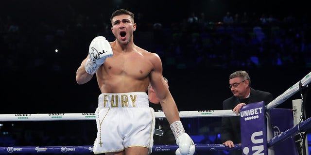 Tommy Fury celebrates victory during the Light-Heavyweight fight between Tommy Fury and Przemslaw Binienda at Copper Box Arena on Dec. 21, 2019 in London, England.