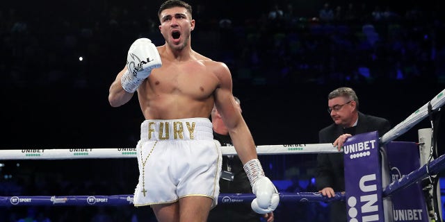 Tommy Fury celebrates victory during the Light-Heavyweight fight between Tommy Fury and Przemslaw Binienda at Copper Box Arena on Dec. 21, 2019 in London, England.