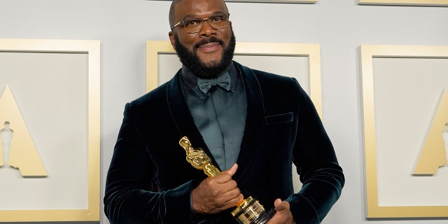 Tyler Perry, winner of the Jean Hersholt Humanitarian Award, poses in the press room at the Oscars on Sunday, April 25, 2021, at Union Station in Los Angeles.