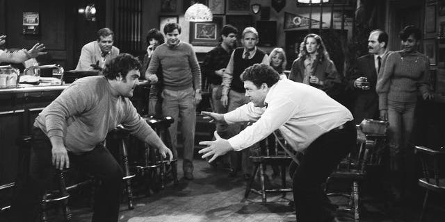 Pictured: (l-r) Walter Olkewicz as Wally Bodell, George Wendt as Norm Peterson in 'Cheers.'