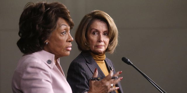 House Speaker Nancy Pelosi looks on as Rep. Maxine Waters speaks at a news conference criticizing then-President Trump's Wall Street policies on Capitol Hill on Feb. 6, 2017. (Mario Tama/Getty Images)