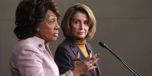 House Speaker Nancy Pelosi looks on as Rep. Maxine Waters speaks at a news conference criticizing then-President Trump's Wall Street policies on Capitol Hill on Feb. 6, 2017. (Mario Tama/Getty Images)