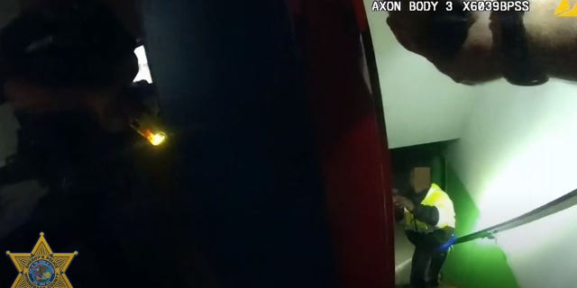 Police said Guetigo was wielding a metal pipe as he approached officers.