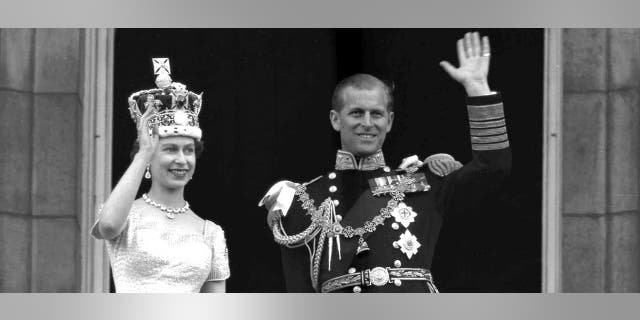 In this June 2, 1953 file photo, Britain's Queen Elizabeth II and her husband, the Duke of Edinburgh, wave from the balcony of Buckingham Palace, London, following the Queen's coronation at Westminster Abbey. Buckingham Palace confirmed Philip's death at the age of 99 last Friday.