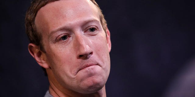 Facebook CEO Mark Zuckerberg's $400 million funding for elections shined the spotlight on his company, which also spiraled down in value. The combination helped make Big Tech one of the year's biggest losers. (Photo by Drew Angerer/Getty Images)