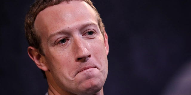 Facebook CEO Mark Zuckerberg's $400 million funding for elections shined the spotlight on his company, which also spiraled down in value. The combination helped make Big Tech one of the year's biggest losers. (Photo by Drew Angerer/Getty Images)