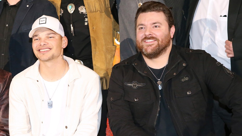 Chris Young surprises Kane Brown on stage to perform their duet ‘Famous Friends’