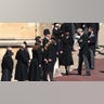 Catherine, Duchess of Cambridge, and members of the royal family stand outside St. George's Chapel on Saturday for the funeral service of Britain's Prince Philip in Windsor Castle. Philip, who was married to Queen Elizabeth II for 73 years, died April 9 at the age of 99, weeks after treatment for a heart condition and infection. (Photo by HANNAH MCKAY / various sources / AFP) (Photo by HANNAH MCKAY/AFP via Getty Images)