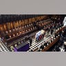 Queen Elizabeth II watches as pallbearers carry the coffin of the Duke of Edinburgh during his funeral at St. George's Chapel in Windsor Castle. Picture date: Saturday April 17, 2021. PA Photo. Following the coffin are the Prince of Wales, the Princess Royal, the Earl of Wessex, the Duke of York, Mr Peter Phillips, the Duke of Cambridge, the Earl of Snowdon, the Duke of Sussex and Vice Admiral Sir Tim Laurence. See PA story FUNERAL Philip. Photo credit should read: Dominic Lipinski/PA Wire