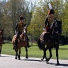 Officers of The King's Troop Royal Horse Artillery arrive for the Gun Salute at the funeral of Britain's Prince Philip at Windsor Castle in Windsor, England on Saturday, April 17, 2021. Prince Philip died April 9 at the age of 99 after 73 years of marriage to Queen Elizabeth II. (Phil Noble/Pool via AP)